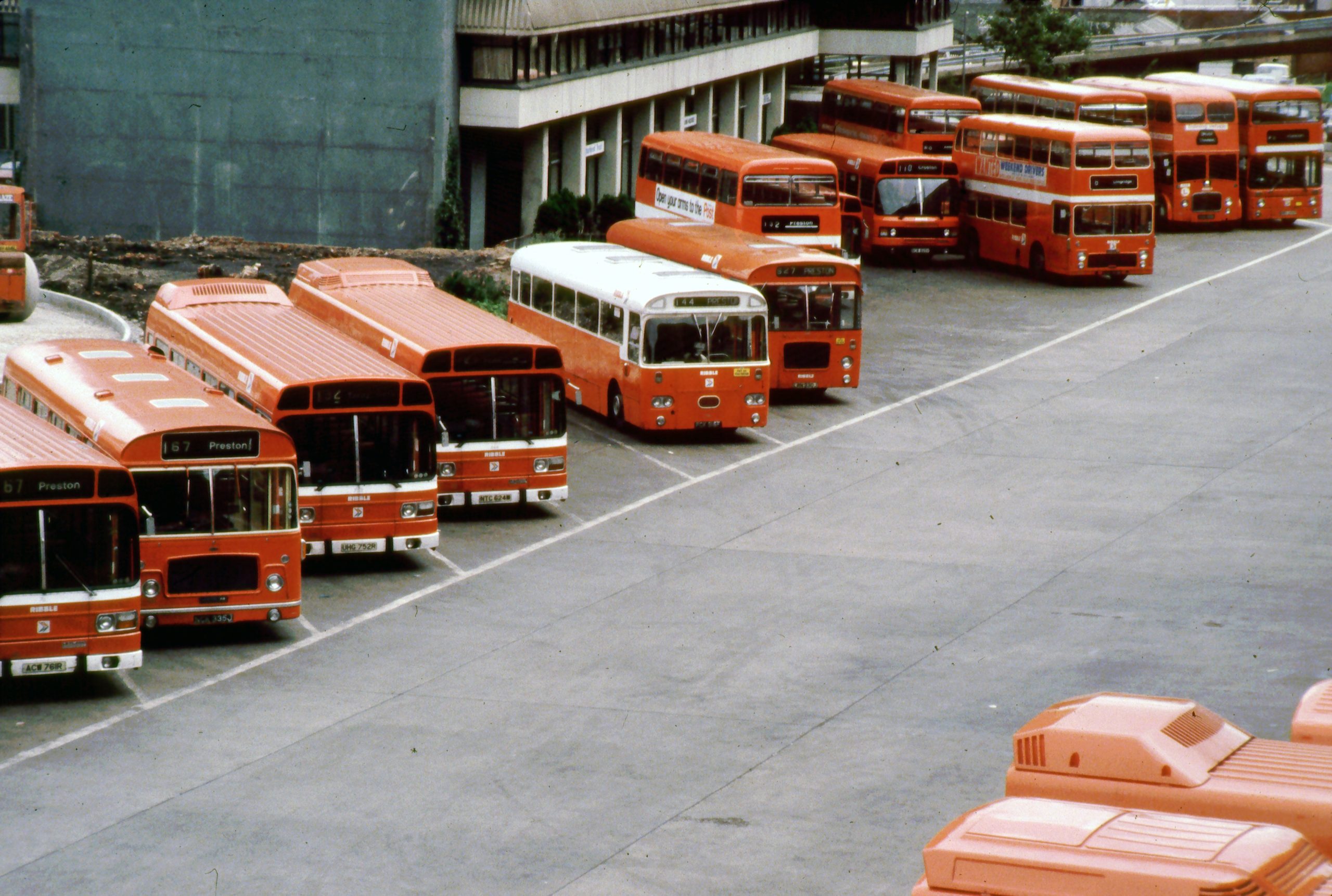 A bus station where several buses are parked