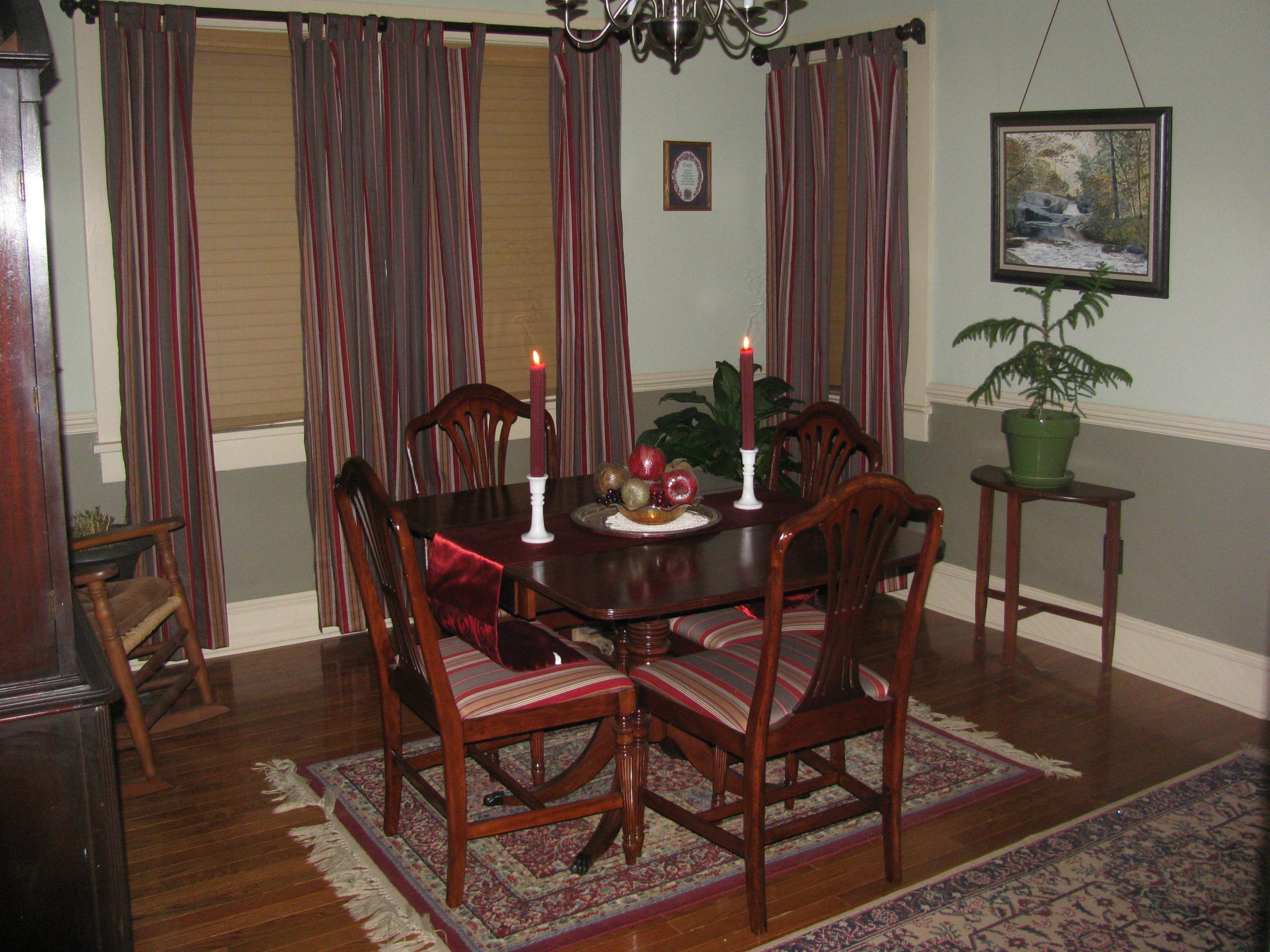 4 person dark wood dining table on persian rug